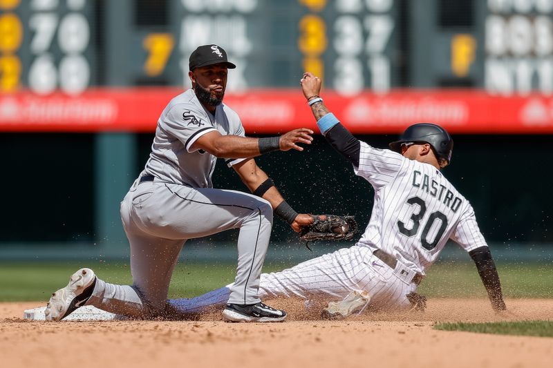 Aug 20, 2023; Denver, Colorado, USA; Colorado Rockies second baseman Harold Castro (30) safely steals second against Chicago White Sox shortstop Elvis Andrus (1) in the fifth inning at Coors Field. Mandatory Credit: Isaiah J. Downing-USA TODAY Sports