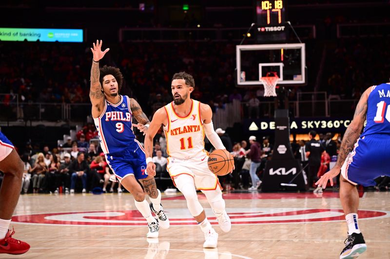 ATLANTA, GA - OCTOBER 14:  Trae Young #11 of the Atlanta Hawks dribbles the ball during the game against the Philadelphia 76ers during a preseason game on October 14, 2024 at State Farm Arena in Atlanta, Georgia.  NOTE TO USER: User expressly acknowledges and agrees that, by downloading and/or using this Photograph, user is consenting to the terms and conditions of the Getty Images License Agreement. Mandatory Copyright Notice: Copyright 2024 NBAE (Photo by Adam Hagy/NBAE via Getty Images)