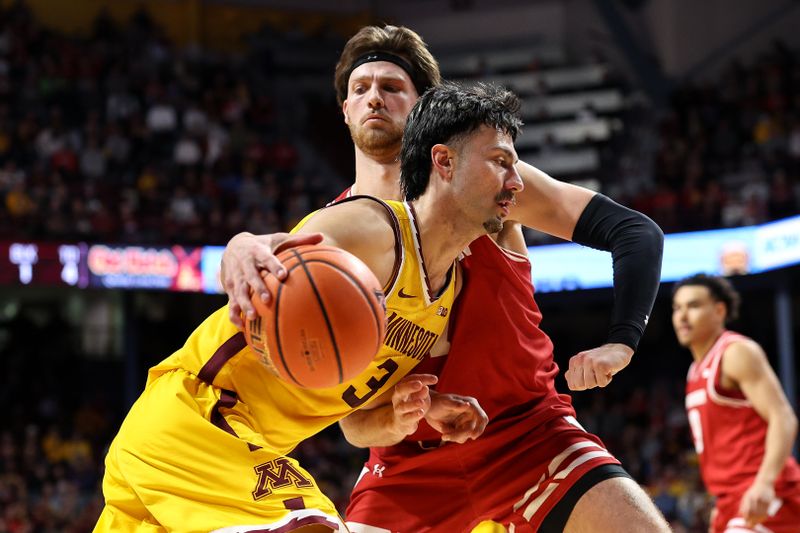 Mar 5, 2025; Minneapolis, Minnesota, USA; Minnesota Golden Gophers forward Dawson Garcia (3) works around Wisconsin Badgers forward Carter Gilmore (7) during the first half at Williams Arena. Mandatory Credit: Matt Krohn-Imagn Images