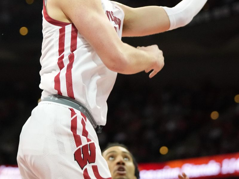 Mar 2, 2023; Madison, Wisconsin, USA;  Wisconsin Badgers guard Max Klesmit (11) shoots the ball during the second half against the Purdue Boilermakers at the Kohl Center. Mandatory Credit: Kayla Wolf-USA TODAY Sports