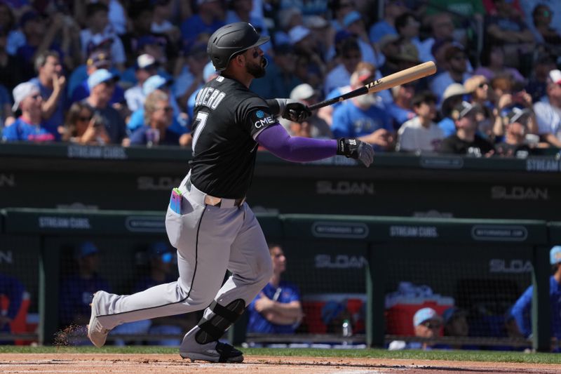 Mar 1, 2026; Mesa, Arizona, USA; Chicago White Sox catcher Edgar Quero (7) hits a solo home run against the Chicago Cubs in the first inning at Sloan Park. Mandatory Credit: Rick Scuteri-Imagn Images