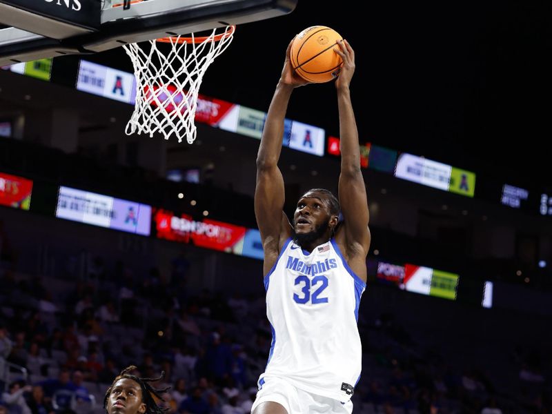 Mar 15, 2025; Fort Worth, TX, USA; Memphis Tigers center Moussa Cisse (32) dunks the ball against the Tulane Green Wave during the first half at Dickies Arena. Mandatory Credit: Chris Jones-Imagn Images