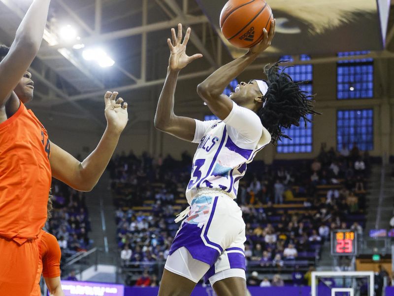 Feb 18, 2023; Seattle, Washington, USA; Washington Huskies guard Keyon Menifield (23) jumps for a layup attempt against the Oregon State Beavers during the first half at Alaska Airlines Arena at Hec Edmundson Pavilion. Mandatory Credit: Joe Nicholson-USA TODAY Sports