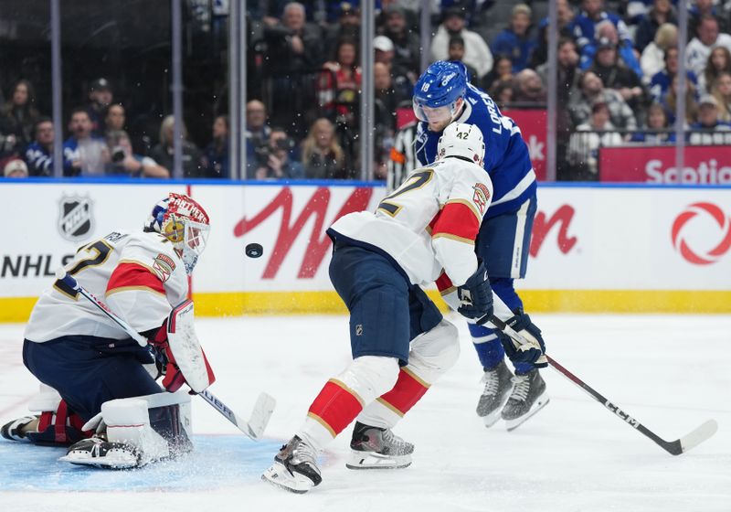 Jan 6, 2026; Toronto, Ontario, CAN; Toronto Maple Leafs center Steven Lorentz (18) battles for the puck in front of Florida Panthers goaltender Sergei Bobrovsky (72) during the third period at Scotiabank Arena. Mandatory Credit: Nick Turchiaro-Imagn Images