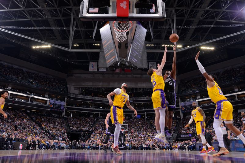 SACRAMENTO, CA - MARCH 13:  De'Aaron Fox #5 of the Sacramento Kings drives to the basket during the game against the Los Angeles Lakers on March 13, 2024 at Golden 1 Center in Sacramento, California. NOTE TO USER: User expressly acknowledges and agrees that, by downloading and or using this Photograph, user is consenting to the terms and conditions of the Getty Images License Agreement. Mandatory Copyright Notice: Copyright 2024 NBAE (Photo by Rocky Widner/NBAE via Getty Images)