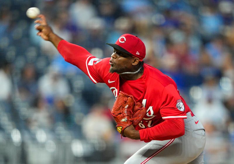 May 28, 2025; Kansas City, Missouri, USA; Cincinnati Reds relief pitcher Luis Mey (62) pitches during the seventh inning against the Kansas City Royals at Kauffman Stadium. Mandatory Credit: Jay Biggerstaff-Imagn Images