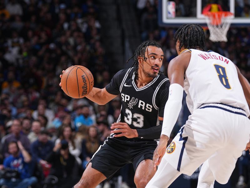 DENVER, CO - JANUARY 3: Tre Jones #33 of the San Antonio Spurs dribbles the ball during the game against the Denver Nuggets on January 3, 2025 at Ball Arena in Denver, Colorado. NOTE TO USER: User expressly acknowledges and agrees that, by downloading and/or using this Photograph, user is consenting to the terms and conditions of the Getty Images License Agreement. Mandatory Copyright Notice: Copyright 2025 NBAE (Photo by Bart Young/NBAE via Getty Images)