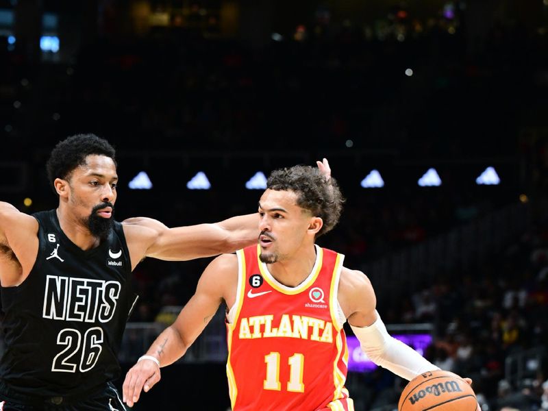 ATLANTA, GA - FEBRUARY 26: Trae Young #11 of the Atlanta Hawks dribbles the ball during the game against the Brooklyn Nets on February 26, 2023 at State Farm Arena in Atlanta, Georgia.  NOTE TO USER: User expressly acknowledges and agrees that, by downloading and/or using this Photograph, user is consenting to the terms and conditions of the Getty Images License Agreement. Mandatory Copyright Notice: Copyright 2023 NBAE (Photo by Adam Hagy/NBAE via Getty Images)