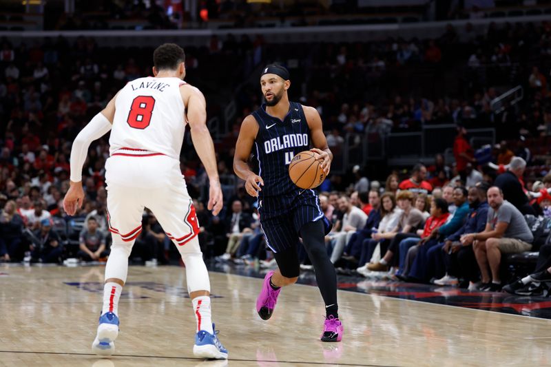 CHICAGO, IL - OCTOBER 30: Jalen Suggs #4 of the Orlando Magic dribbles the ball during the game against the Chicago Bulls on October 30, 2024 at United Center in Chicago, Illinois. NOTE TO USER: User expressly acknowledges and agrees that, by downloading and or using this photograph, User is consenting to the terms and conditions of the Getty Images License Agreement. Mandatory Copyright Notice: Copyright 2024 NBAE (Photo by Kamil Krzaczynski/NBAE via Getty Images)