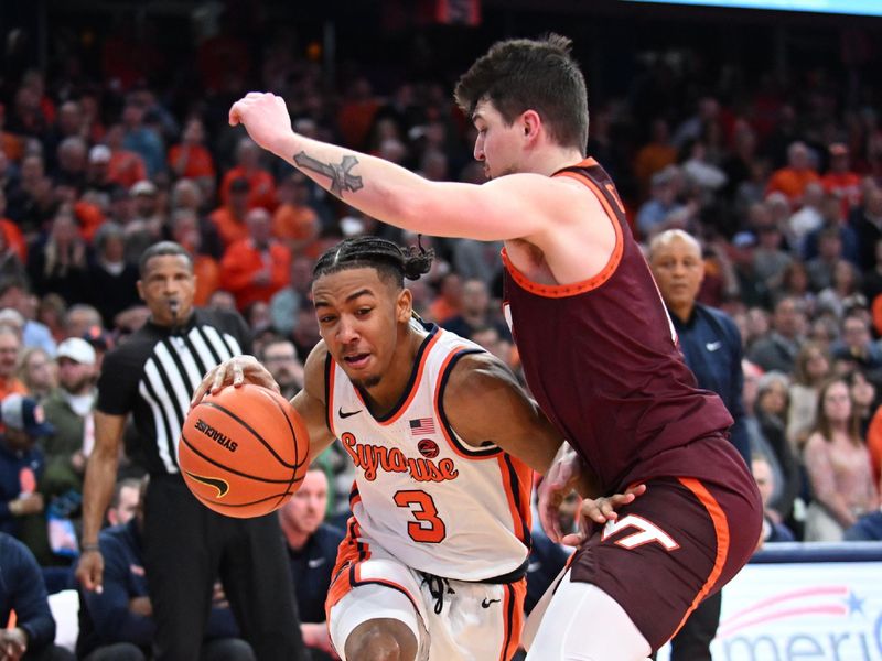 Feb 27, 2024; Syracuse, New York, USA; Syracuse Orange guard Judah Mintz (3) tries to move the ball past Virginia Tech Hokies guard Hunter Cattoor in the second half at the JMA Wireless Dome. Mandatory Credit: Mark Konezny-USA TODAY Sports