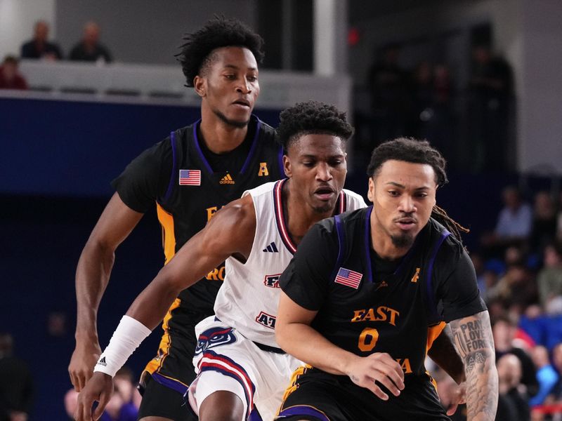 Jan 2, 2024; Boca Raton, Florida, USA; East Carolina Pirates guard Bobby Pettiford Jr. (0) dribbles the ball up the court against the Florida Atlantic Owls during the first half at Eleanor R. Baldwin Arena. Mandatory Credit: Rich Storry-USA TODAY Sports