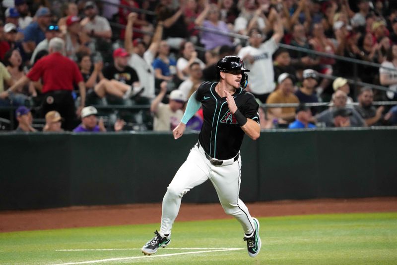 Jul 12, 2024; Phoenix, Arizona, USA; Arizona Diamondbacks shortstop Kevin Newman (18) rounds third and scores a run against the Toronto Blue Jays during the third inning at Chase Field. Mandatory Credit: Joe Camporeale-USA TODAY Sports