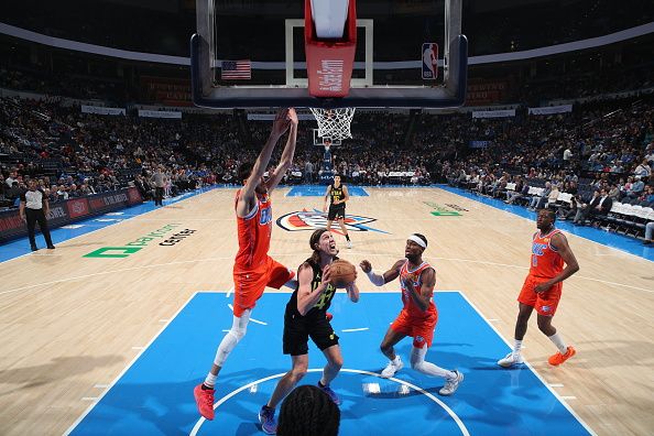 OKLAHOMA CITY, OK - DECEMBER 11: Kelly Olynyk #41 of the Utah Jazz handles the ball during the game against the Oklahoma City Thunder on December 11, 2023 at Paycom Arena in Oklahoma City, Oklahoma. NOTE TO USER: User expressly acknowledges and agrees that, by downloading and or using this photograph, User is consenting to the terms and conditions of the Getty Images License Agreement. Mandatory Copyright Notice: Copyright 2023 NBAE (Photo by Zach Beeker/NBAE via Getty Images)