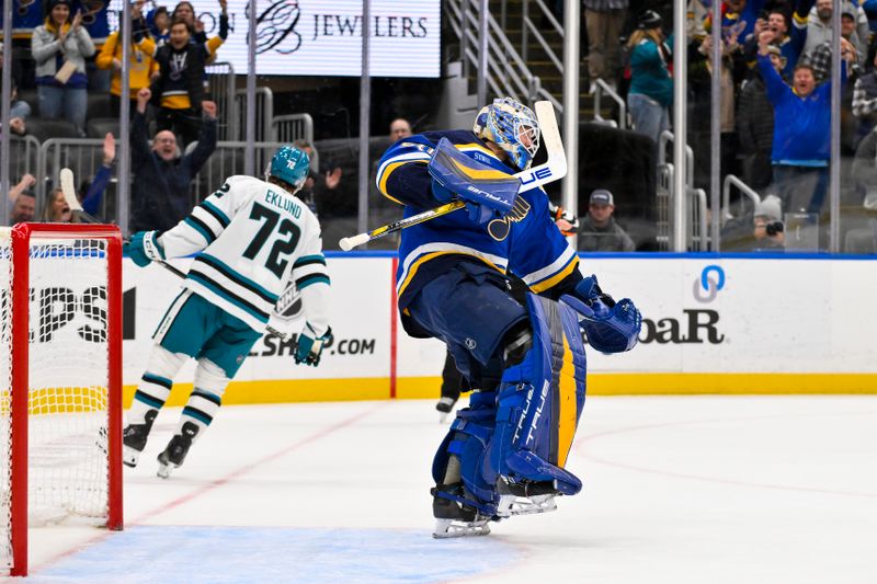 Nov 21, 2024; St. Louis, Missouri, USA;  St. Louis Blues goaltender Jordan Binnington (50) reacts after saving a shot by San Jose Sharks left wing William Eklund (72) giving the Blues a win in shootouts at Enterprise Center. Mandatory Credit: Jeff Curry-Imagn Images