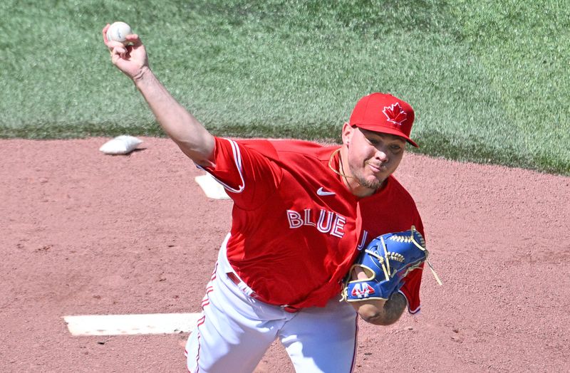 Jul 1, 2024; Toronto, Ontario, CAN;  Toronto Blue Jays starting pitcher Yariel Rodriguez (29) delivers a pitch against the Houston Astros in the first inning at Rogers Centre. Mandatory Credit: Dan Hamilton-USA TODAY Sports