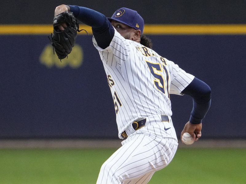 May 4, 2025; Milwaukee, Wisconsin, USA; Milwaukee Brewers pitcher Freddy Peralta (51) delivers a pitch against the Chicago Cubs in the first inning at American Family Field. Mandatory Credit: Michael McLoone-Imagn Images