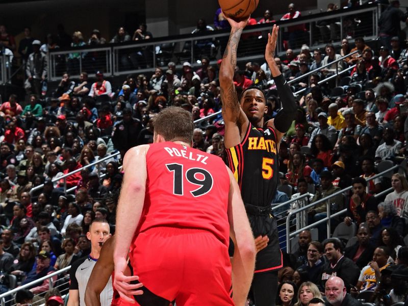 ATLANTA, GA - February 23:  Dejounte Murray #5 of the Atlanta Hawks shoots a three point basket during the game aghast the Toronto Raptors on February 23, 2024 at State Farm Arena in Atlanta, Georgia.  NOTE TO USER: User expressly acknowledges and agrees that, by downloading and/or using this Photograph, user is consenting to the terms and conditions of the Getty Images License Agreement. Mandatory Copyright Notice: Copyright 2024 NBAE (Photo by Scott Cunningham/NBAE via Getty Images)