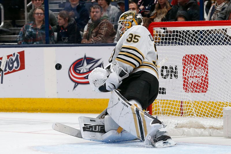 Jan 2, 2024; Columbus, Ohio, USA; Boston Bruins goalie Linus Ullmark (35) makes a save against the Columbus Blue Jackets during the first period at Nationwide Arena. Mandatory Credit: Russell LaBounty-USA TODAY Sports