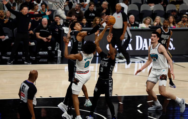 SAN ANTONIO, TX - JANUARY15:  Victor Wembanyama #1 of the San Antonio Spurs blocks shot of Jaylen Wells #0 of the Memphis Grizzlies in the first half at Frost Bank Center on January 15, 2025 in San Antonio, Texas. NOTE TO USER: User expressly acknowledges and agrees that, by downloading and or using this photograph, User is consenting to terms and conditions of the Getty Images License Agreement. (Photo by Ronald Cortes/Getty Images)