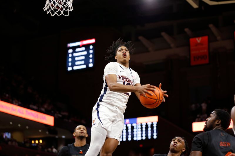 Feb 5, 2024; Charlottesville, Virginia, USA; Virginia Cavaliers guard Elijah Gertrude (12) shoots the ball against the Miami (Fl) Hurricanes during the second half at John Paul Jones Arena. Mandatory Credit: Amber Searls-USA TODAY Sports