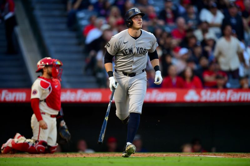 May 27, 2025; Anaheim, California, USA; New York Yankees designated hitter Ben Rice (22) hits a solo home run against the Los Angeles Angels during the fourth inning at Angel Stadium. Mandatory Credit: Gary A. Vasquez-Imagn Images