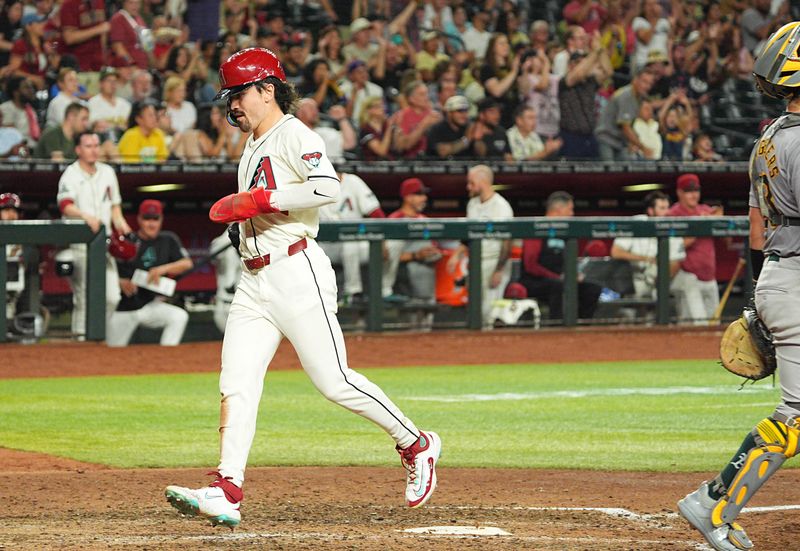 Jun 28, 2024; Phoenix, Arizona, USA; Arizona Diamondbacks outfielder Corbin Carroll (7) scores after a single by infielder Ketel Marte (4) not shown in the seventh inning against the Oakland Athletics at Chase Field. Mandatory Credit: Allan Henry-USA TODAY Sports