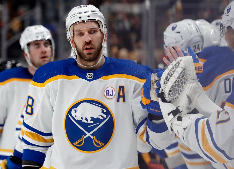 Jan 6, 2024; Pittsburgh, Pennsylvania, USA;  Buffalo Sabres left wing Zemgus Girgensons (28) celebrates with the Sabres bench after scoring a goal against the Pittsburgh Penguins during the third period at PPG Paints Arena. Buffalo won 3-1. Mandatory Credit: Charles LeClaire-USA TODAY Sports