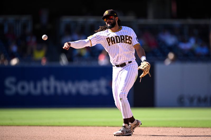 Sep 6, 2023; San Diego, California, USA; San Diego Padres second baseman Fernando Tatis Jr. (23) throws to first base during the ninth inning against the Philadelphia Phillies at Petco Park. Mandatory Credit: Orlando Ramirez-USA TODAY Sports