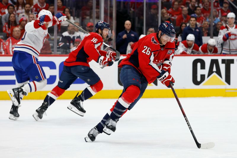Apr 21, 2025; Washington, District of Columbia, USA; Washington Capitals center Nic Dowd (26) skates with the puck against the Montreal Canadiens in the second period in game one of the first round of the 2025 Stanley Cup Playoffs at Capital One Arena. Mandatory Credit: Geoff Burke-Imagn Images