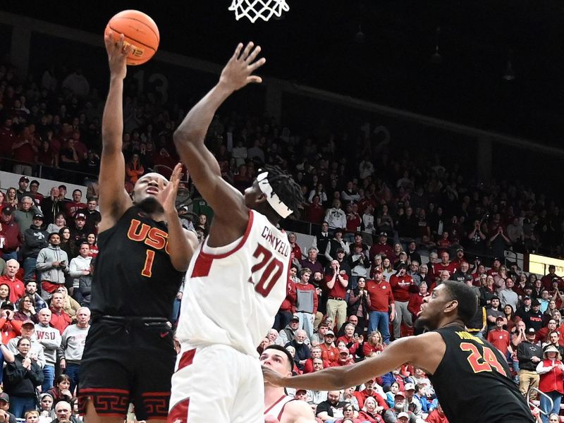 Feb 29, 2024; Pullman, Washington, USA; USC Trojans guard Isaiah Collier (1) shoots the ball against Washington State Cougars center Rueben Chinyelu (20) in the second half at Friel Court at Beasley Coliseum. Washington State Cougars won 75-72. Mandatory Credit: James Snook-USA TODAY Sports