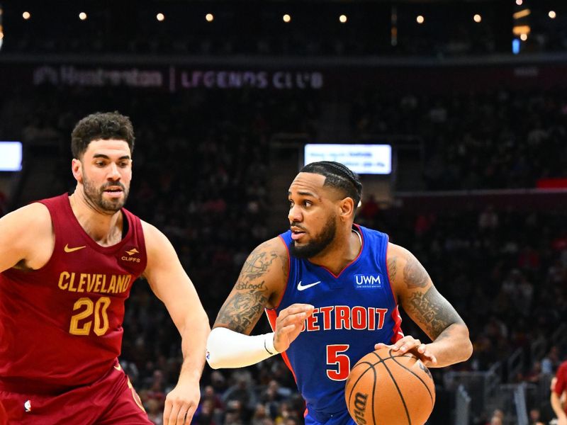 CLEVELAND, OHIO - JANUARY 31: Monte Morris #5 of the Detroit Pistons drives to against Georges Niang #20 of the Cleveland Cavaliers during the third quarter at Rocket Mortgage Fieldhouse on January 31, 2024 in Cleveland, Ohio. The Cavaliers defeated the Pistons 128-121. (Photo by Jason Miller/Getty Images) NOTE TO USER: User expressly acknowledges and agrees that, by downloading and or using this photograph, User is consenting to the terms and conditions of the Getty Images License Agreement. (Photo by Jason Miller/Getty Images)