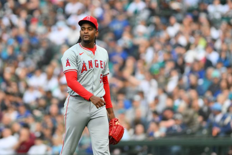 May 31, 2024; Seattle, Washington, USA; Los Angeles Angels starting pitcher Jose Soriano (59) walks off the field after the final out of the first inning against the Seattle Mariners at T-Mobile Park. Mandatory Credit: Steven Bisig-USA TODAY Sports