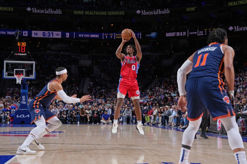 PHILADELPHIA, PA - APRIL 28: Tyrese Maxey #0 of the Philadelphia 76ers shoots a three point basket during the game against the New York Knicks during Round 1 Game 4 of the 2024 NBA Playoffs on April 28, 2024 at the Wells Fargo Center in Philadelphia, Pennsylvania NOTE TO USER: User expressly acknowledges and agrees that, by downloading and/or using this Photograph, user is consenting to the terms and conditions of the Getty Images License Agreement. Mandatory Copyright Notice: Copyright 2024 NBAE (Photo by Jesse D. Garrabrant/NBAE via Getty Images)