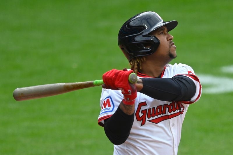 May 31, 2025; Cleveland, Ohio, USA; Cleveland Guardians third baseman Jose Ramirez (11) hits a solo home run in the fifth inning against the Los Angeles Angels at Progressive Field. Mandatory Credit: David Richard-Imagn Images
