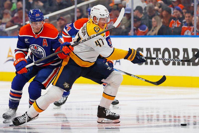 Nov 14, 2024; Edmonton, Alberta, CAN; Nashville Predators forward Michael McCarron (47) and Edmonton Oilers forward Ryan Nugent-Hopkins (93) battle for a loose puck during the third period at Rogers Place. Mandatory Credit: Perry Nelson-Imagn Images