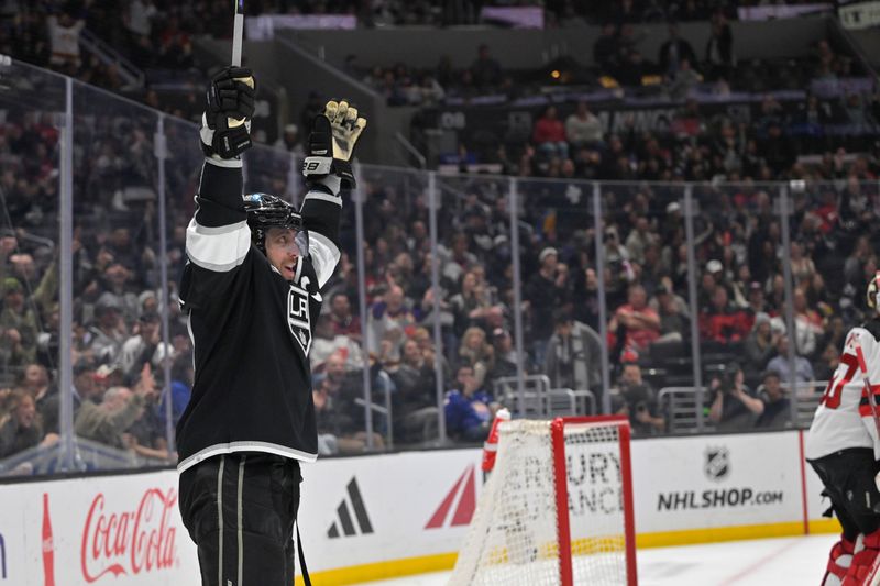 Mar 3, 2024; Los Angeles, California, USA; Los Angeles Kings center Anze Kopitar (11) celebrates after an assist on a goal in the second period against the New Jersey Devils at Crypto.com Arena. Mandatory Credit: Jayne Kamin-Oncea-USA TODAY Sports