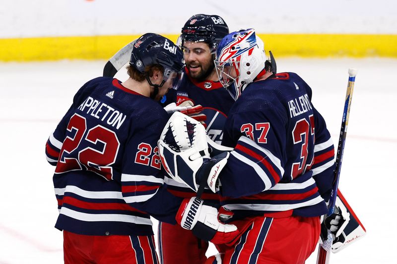 Feb 14, 2024; Winnipeg, Manitoba, CAN; Winnipeg Jets celebrate their victory over the San Jose Sharks at Canada Life Centre. Mandatory Credit: James Carey Lauder-USA TODAY Sports