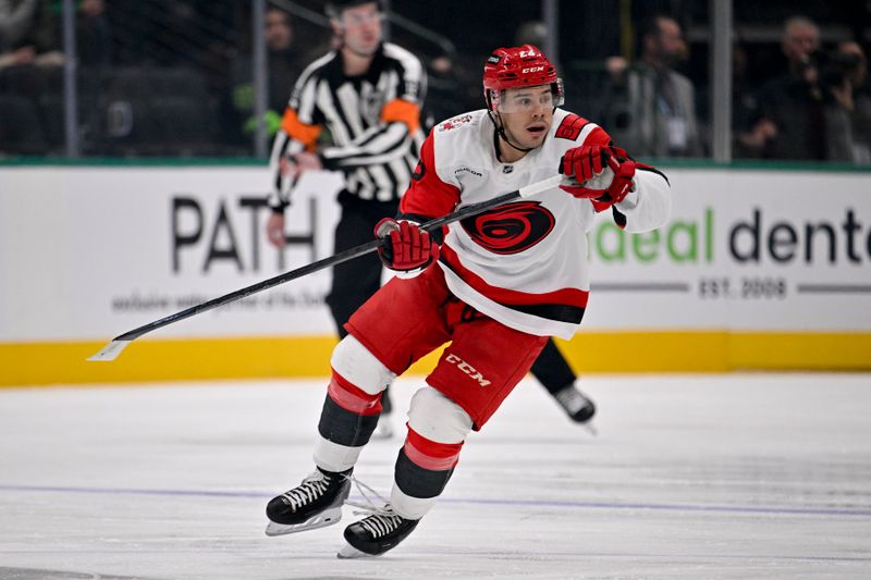 Oct 25, 2025; Dallas, Texas, USA; Carolina Hurricanes center Logan Stankoven (22) skates against the Dallas Stars during the first period at the American Airlines Center. Mandatory Credit: Jerome Miron-Imagn Images
