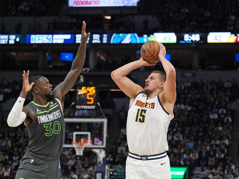 MINNEAPOLIS, MN - NOVEMBER 1: Nikola Jokic #15 of the Denver Nuggets shoots a three point basket during the game against the Minnesota Timberwolves on November 1, 2024 at Target Center in Minneapolis, Minnesota. NOTE TO USER: User expressly acknowledges and agrees that, by downloading and or using this Photograph, user is consenting to the terms and conditions of the Getty Images License Agreement. Mandatory Copyright Notice: Copyright 2024 NBAE (Photo by Jordan Johnson/NBAE via Getty Images)