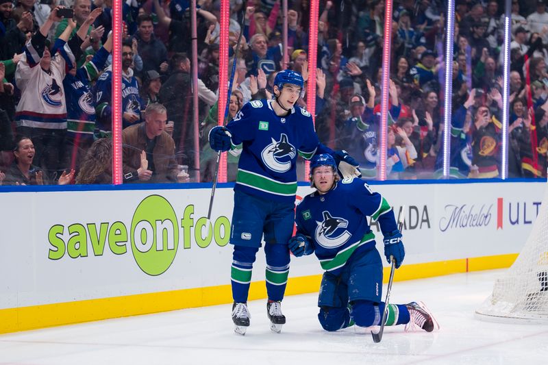 Mar 16, 2024; Vancouver, British Columbia, CAN; Vancouver Canucks forward Ilya Mikheyev (65) and forward Brock Boeser (6) celebrate Boeser’s goal against the Washington Capitals in the first period at Rogers Arena. Mandatory Credit: Bob Frid-USA TODAY Sports