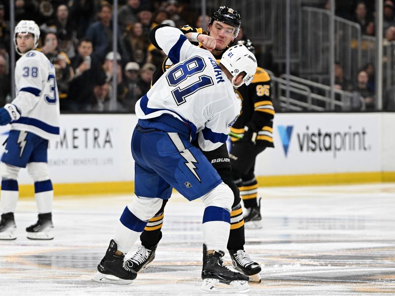 Jan 14, 2025; Boston, Massachusetts, USA; Boston Bruins defenseman Nikita Zadorov (91) fights Tampa Bay Lightning defenseman Erik Cernak (81) during the third period at the TD Garden. Mandatory Credit: Brian Fluharty-Imagn Images