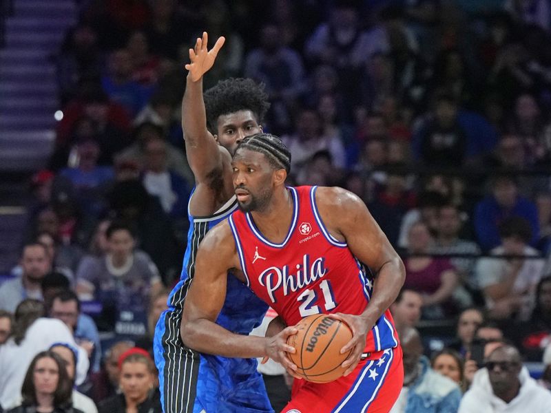 PHILADELPHIA, PA - APRIL 12: Joel Embiid #21 of the Philadelphia 76ers looks to pass the ball during the game against the Orlando Magic on April 12, 2024 at the Wells Fargo Center in Philadelphia, Pennsylvania NOTE TO USER: User expressly acknowledges and agrees that, by downloading and/or using this Photograph, user is consenting to the terms and conditions of the Getty Images License Agreement. Mandatory Copyright Notice: Copyright 2024 NBAE (Photo by Jesse D. Garrabrant/NBAE via Getty Images)