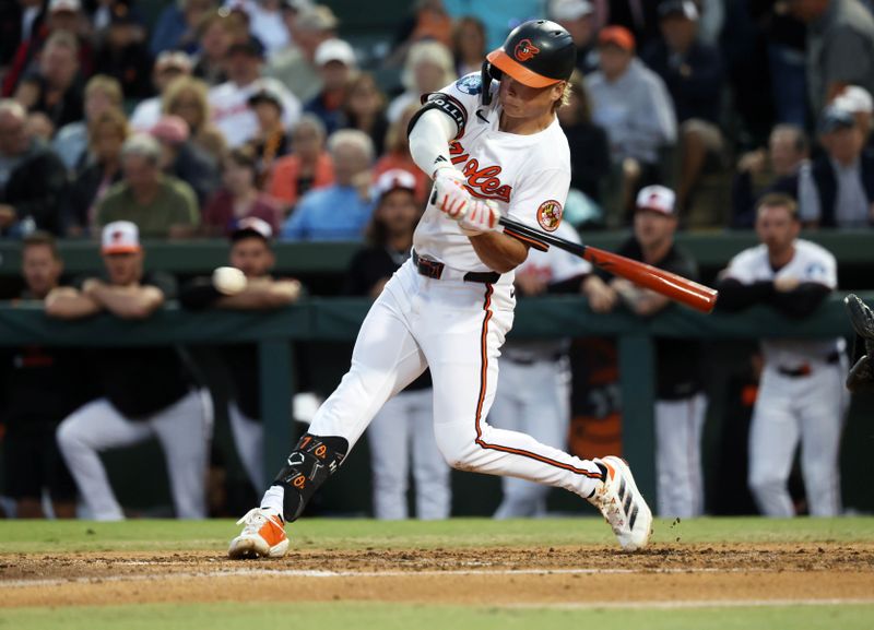 Mar 20, 2025; Sarasota, Florida, USA;  Baltimore Orioles second base Jackson Holliday (7) singles during the third inning against the New York Yankees at Ed Smith Stadium. Mandatory Credit: Kim Klement Neitzel-Imagn Images