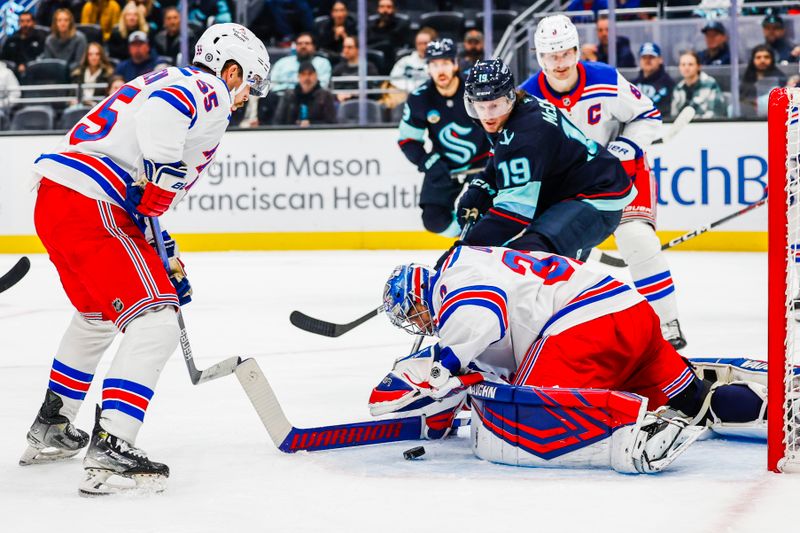 Nov 17, 2024; Seattle, Washington, USA; New York Rangers goaltender Igor Shesterkin (31) makes a save against Seattle Kraken left wing Jared McCann (19) during the third period at Climate Pledge Arena. Mandatory Credit: Joe Nicholson-Imagn Images