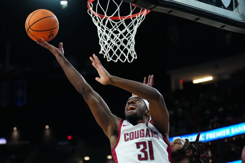 Mar 15, 2024; Las Vegas, NV, USA; Washington State Cougars guard Kymany Houinsou (31) shoots the ball in the first half against the Washington State Cougars at T-Mobile Arena. Mandatory Credit: Kirby Lee-USA TODAY Sports