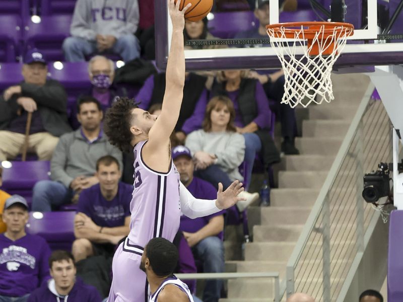 Jan 14, 2023; Fort Worth, Texas, USA;  Kansas State Wildcats forward Ismael Massoud (25) shoots over TCU Horned Frogs guard Rondel Walker (11) during the first half at Ed and Rae Schollmaier Arena. Mandatory Credit: Kevin Jairaj-USA TODAY Sports