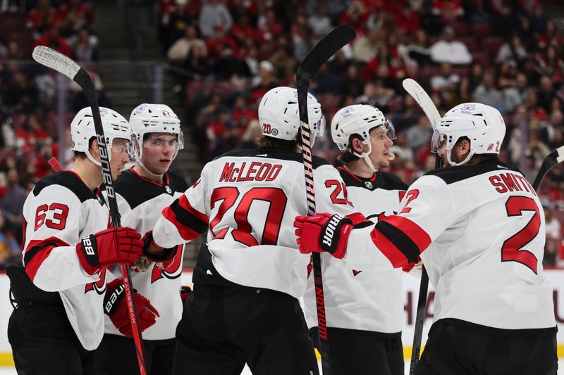 Jan 13, 2024; Sunrise, Florida, USA; New Jersey Devils left wing Jesper Bratt (63) celebrates withteammtes after scoring against the Florida Panthers during the first period at Amerant Bank Arena. Mandatory Credit: Sam Navarro-USA TODAY Sports