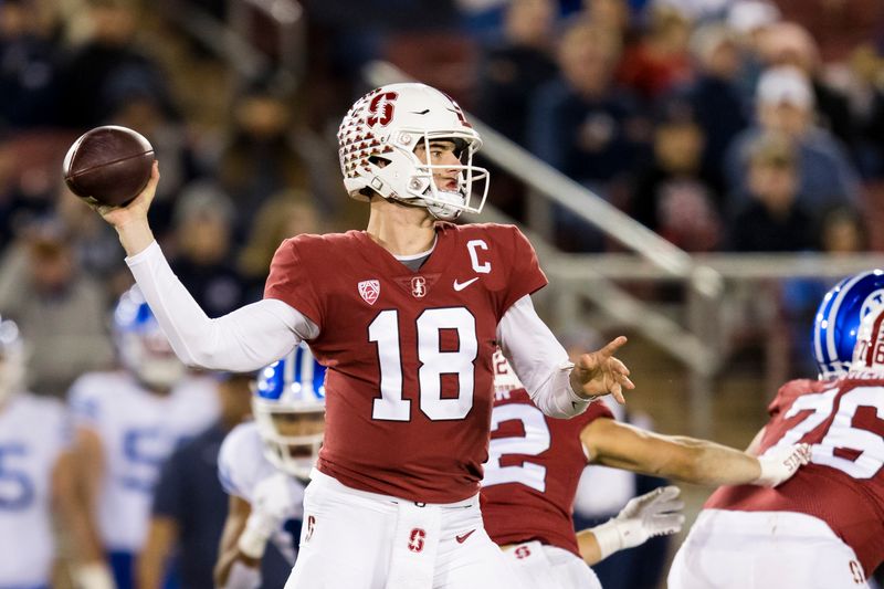 Nov 26, 2022; Stanford, California, USA; Stanford Cardinal quarterback Tanner McKee (18) throws a pass against the Brigham Young Cougars during the first half at Stanford Stadium. Mandatory Credit: John Hefti-USA TODAY Sports