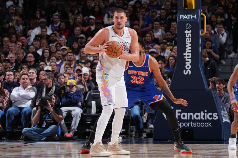 DENVER, CO - NOVEMBER 25: Nikola Jokic #15 of the Denver Nuggets looks to pass the ball during the game against the New York Knicks on November 25, 2024 at Ball Arena in Denver, Colorado. NOTE TO USER: User expressly acknowledges and agrees that, by downloading and/or using this Photograph, user is consenting to the terms and conditions of the Getty Images License Agreement. Mandatory Copyright Notice: Copyright 2024 NBAE (Photo by Garrett Ellwood/NBAE via Getty Images)