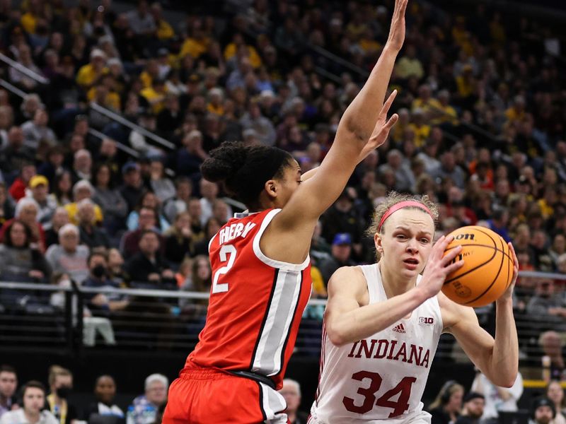 Mar 4, 2023; Minneapolis, MINN, USA; Indiana Hoosiers guard Grace Berger (34) drives to the basket while Ohio State Buckeyes forward Taylor Thierry (2) defends during the second half at Target Center. Mandatory Credit: Matt Krohn-USA TODAY Sports